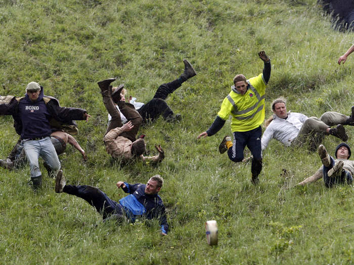 Participants run full-speed downhill to catch the rolling wedge.