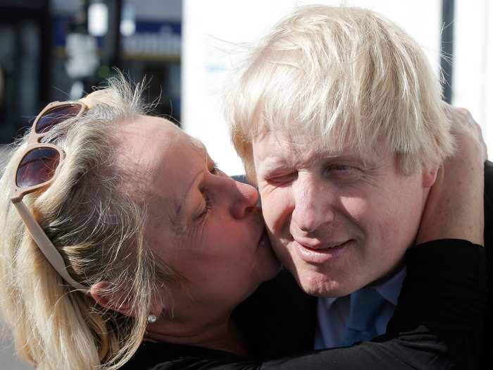 A supporter plants a kiss on Johnson