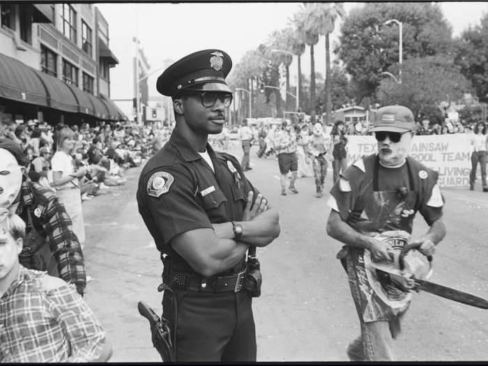 Officer Kevin Hall monitors the Doo Dah Parade, a flamboyant parade held in Pasadena every year.