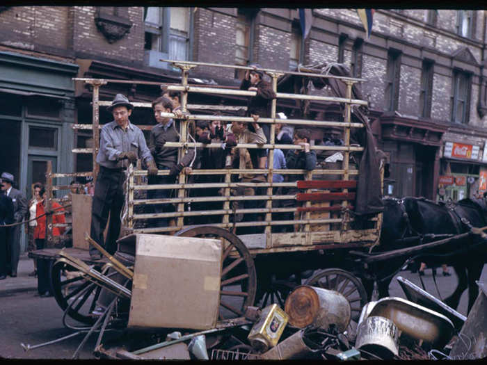 The men pictured here are collecting wartime salvage left outside on the streets of the Lower East Side.