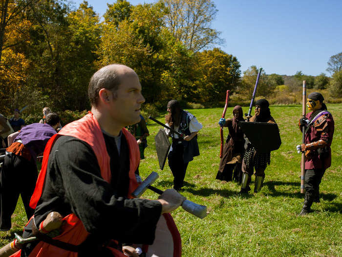 The skill of more veteran players comes out in combat even if they are of a lower level. Joe, who has been playing for more than 20 years, rips through the battlefield with his sword and shield.