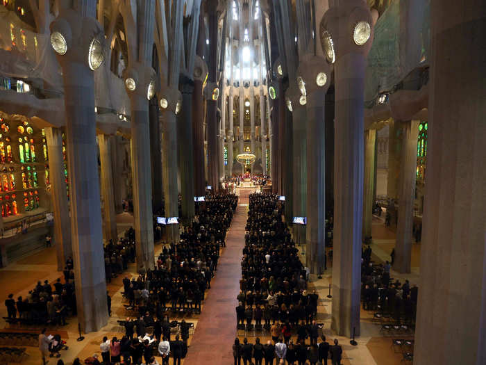 The interior is massive and wide, with high, arching pillars.