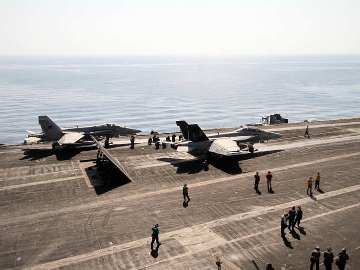 We took this picture from "Vultures Row," overlooking the flight deck as it sends F/A-18s on patrol over the Persian Gulf.