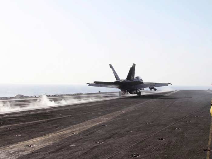 And with barely time to drag the camera around, the 30,000-pound jet is flung like a toy down the length of the deck.