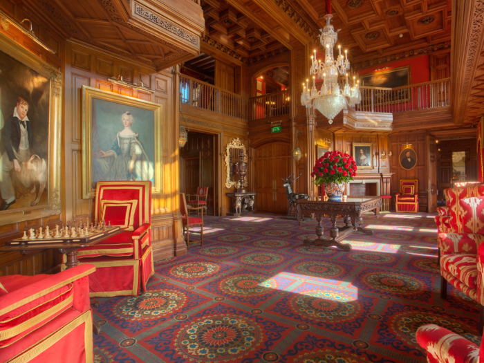 Guests can relax on the plush velvet couches or enjoy a game of chess in the lobby.