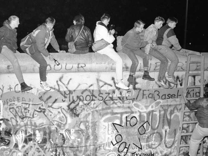 While in the past those trying to cross the border would resort to digging tunnels, leaping out of buildings that lined the border, or attempting to drive through, on November 9, West German citizens climbed freely atop the Berlin Wall.