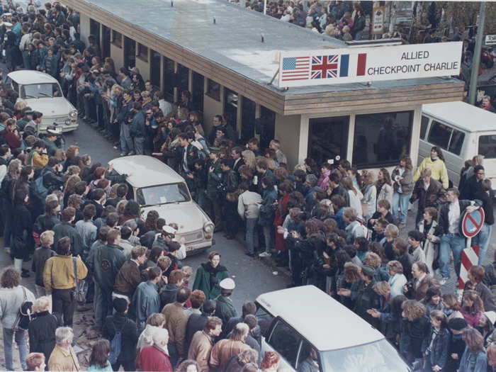 West Germans applauded as East Berlin citizens traveled through Checkpoint Charlie on the following day, November 10.