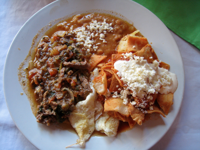 MEXICO: The first meal of the day is hearty, with dishes like chilaquiles (below) and huevos rancheros being popular choices. Sweet rolls and coffee are lighter options.