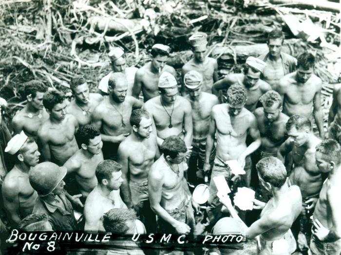Marines come to collect their letters from home while stationed in Bougainville.