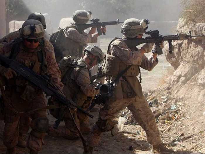 The "Darkhorse" Marines in the 3rd Battalion, 5th Regiment, suffered the highest casualty rate of any Marine unit deployed to the Helmand province in southern Afghanistan following the heavy Marine-led assault on Marjah. Here is a photo of them under enemy sniper fire in 2010.