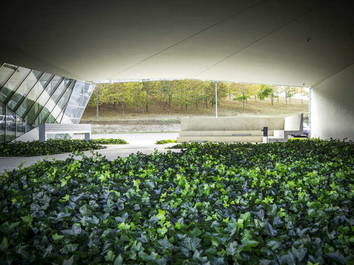 Small reminders of nature are embedded in the landscape of the building, including a forest in the parking lot and a garden wrapping the perimeter.