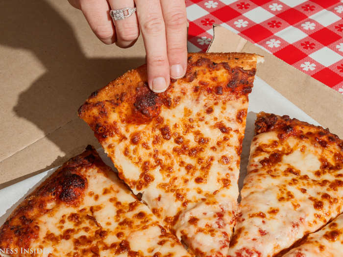 The crust feels crispy but it has give — a tell tale sign of a really, really good crust. One bite in, and I