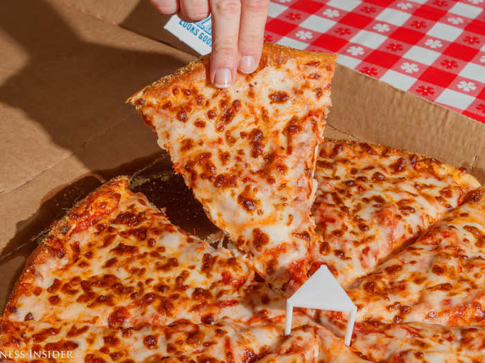 The crust is doughy and thick, and a little too spongy for my taste. But the top of the cheese looks browned to perfection.