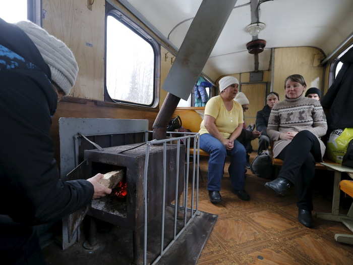 The train cars are heated by wood–fired stoves, often stoked by the passengers themselves.