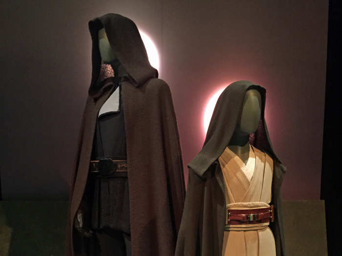 These are the outfits worn by Luke Skywalker (Mark Hamill) and Anakin Skywalker (Jake Lloyd), respectively, in "Return of the Jedi" and "The Phantom Menace." Luke was dressed in black to show his conflict with turning to the dark side.