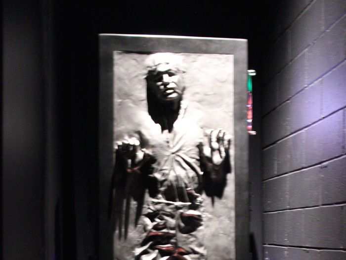 Jabba the Hutt can be heard laughing menacingly over Han Solo frozen in carbonite in his own private little cell.