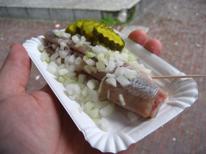 NETHERLANDS: Herring stands serve the fish in a variety of ways. That includes everything from fillets cut into pieces with chopped raw onions and pickles to whole fillets you can eat with your hands.