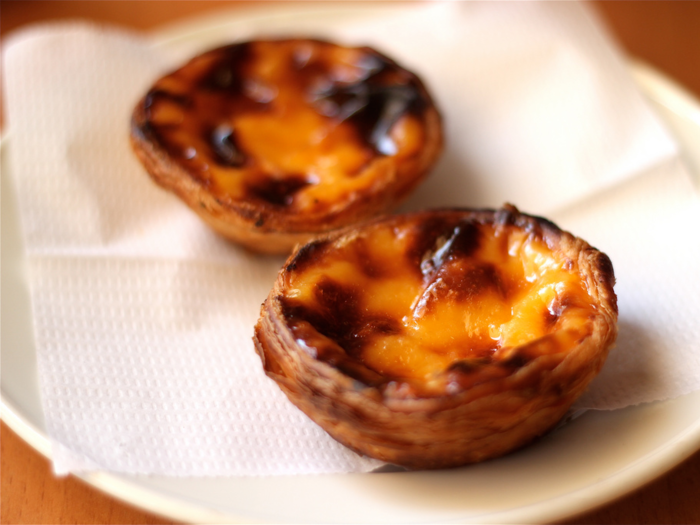 PORTUGAL: Pastel de nata is a baked pastry tart filled with egg custard and hints of lemon, cinnamon, and vanilla. The treat is sold in bakeries and street stalls.