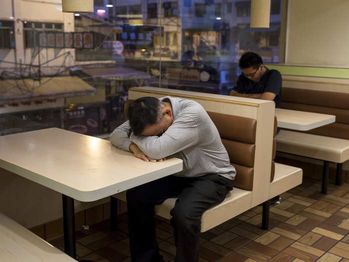 "As other diners enjoyed their Big Macs past midnight, no one noticed the middle-aged woman who appeared to be sleeping at her table," reports the Associated Press.