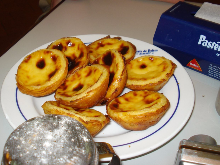 Bite into sublime custard tarts with flavors of lemon, cinnamon, and vanilla in Portugal. The most iconic shop is Antiga Confeitaria de Belém in Lisbon.