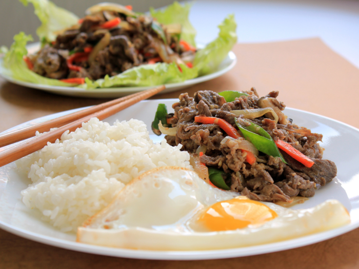 While in Korea, taste the flavors of beef bulgogi, thinly sliced, prime cuts of meat marinated in a mixture of soy sauce, sesame oil, garlic, onions, ginger, sugar, and wine.