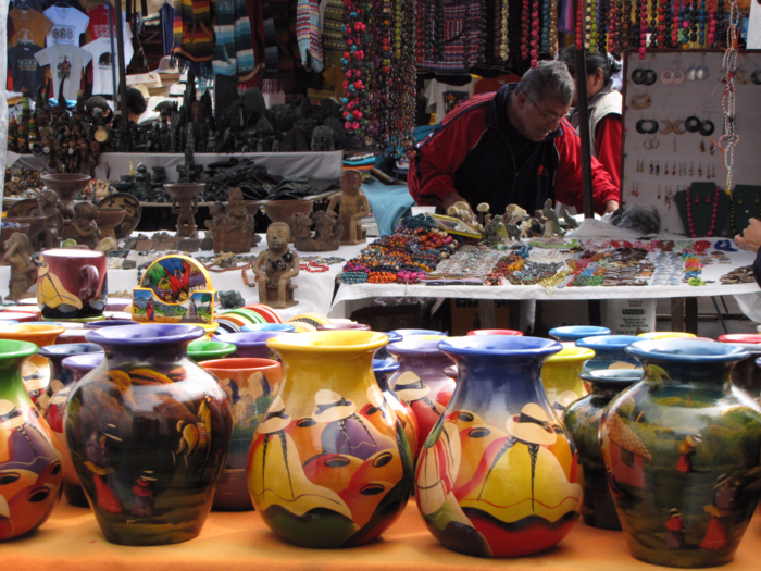 Go shopping in Otavalo, Ecuador, where rainbows of textiles, scarves, wall displays, hand bags, and sweaters can be bought.