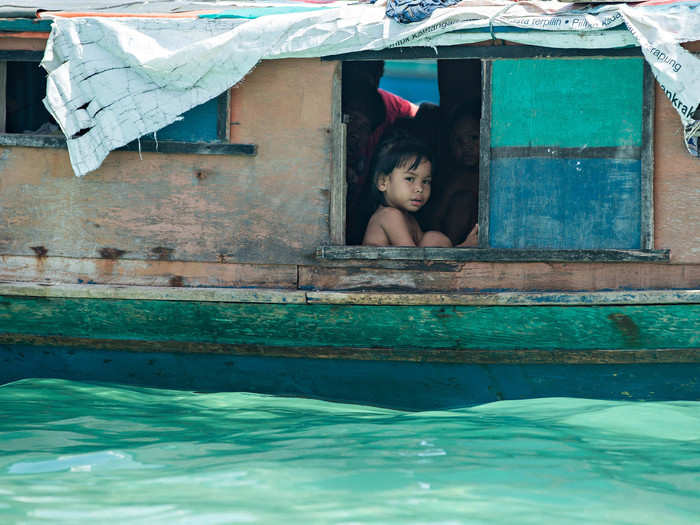 The Bajau traditionally live in small boats, spending their days drifting in the ocean and relying on fishing to make a living, hence their nickname, "sea gypsies."