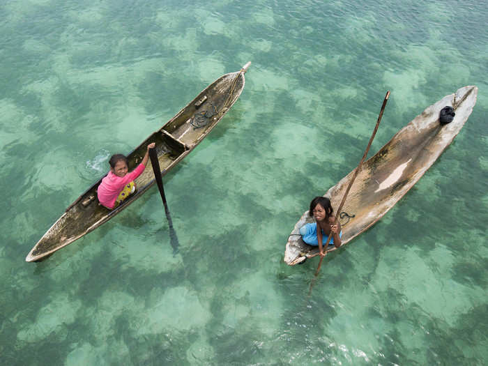 And gliding along the water in boats.