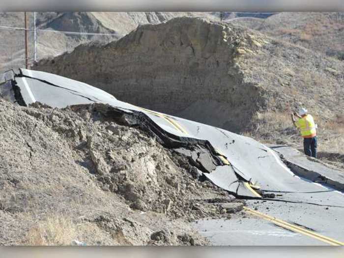 The dirt from the landslide simply washed away the road.