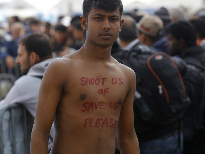 A migrant looks on, as he waits to cross the border from Greece to Gevgelija, Macedonia.