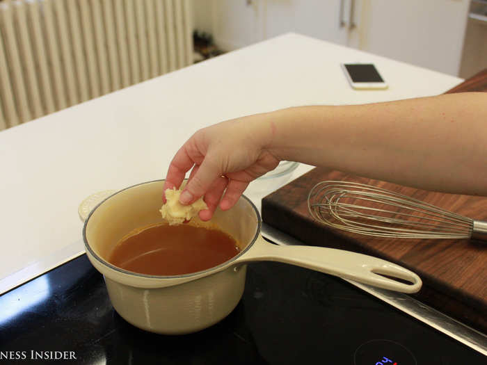 One by one, drop bits of the beurre manié into a pot of boiling, low-sodium chicken stock and whisk vigorously until the gravy thickens.