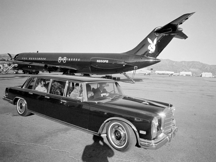 Pictured here, Hefner leaves in his Mercedes-Benz limousine with the Playboy jet in the background.