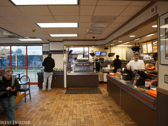 Aside from the historical memorabilia, the inside of a Whataburger is like most fast food chains. It has relatively dim lighting, dark tiled floors, and a mostly hidden kitchen.