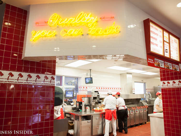 The atmosphere inside is different from most fast food chains — the light is bright, the kitchen is open, and the bright red tiles add a colorful touch.