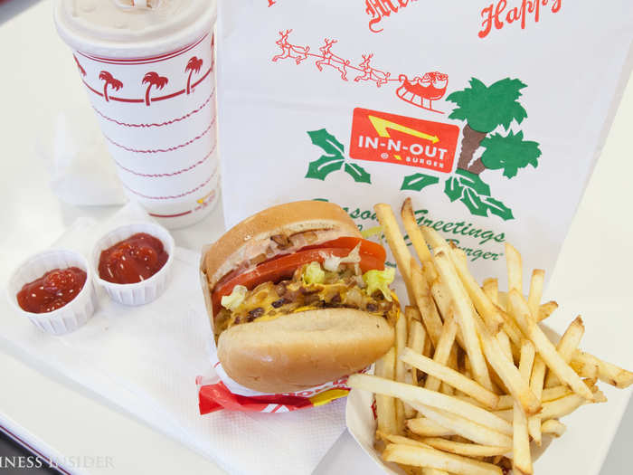 Right off the bat, you can see the fresher ingredients used in the In-N-Out burger — thicker tomato slices, greener lettuce, and their famed "secret sauce." Significantly smaller, this burger has a sweeter taste, no pickles, and no mustard. Packed with ingredients, it took two bites to get to the actual burger patty.