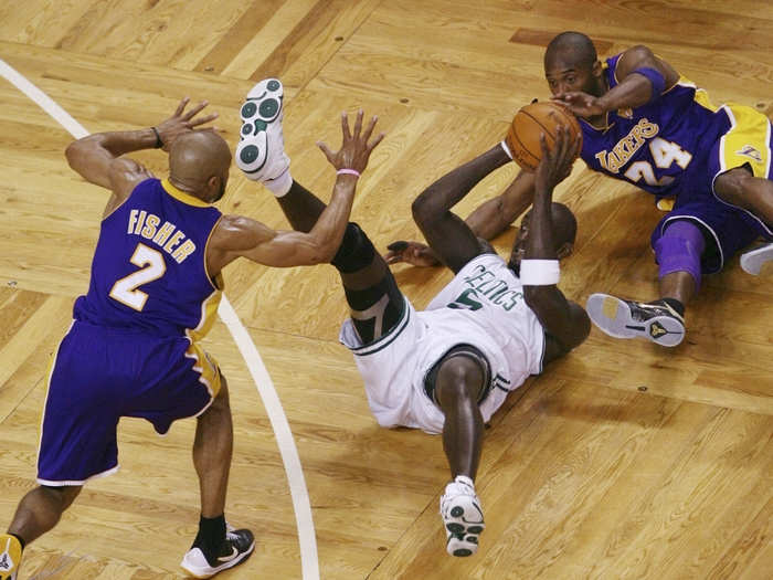 Bryant dives for a loose ball while playing the Boston Celtics in the 2010 NBA Finals. The Lakers would go on to win the series, and Bryant was once again awarded the Finals MVP trophy.