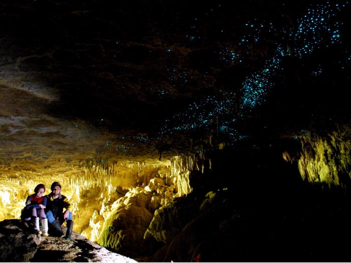 Take a boat ride through the Waitomo Glowworm Caves of Waitomo, on the North Island of New Zealand. A large population of glowworms causes the cave to glitter.