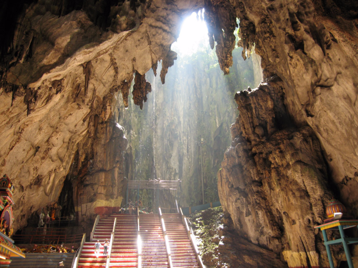 The Batu Caves of Selangor, Malaysia, feature stunning temples and paintings that depict Hindu gods. Before entering the caves, marvel at the enormous statue of Lord Morugan in the entrance.