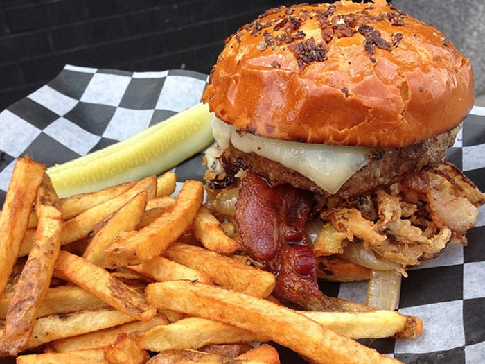 RHODE ISLAND: The Abbey in Providence is a little pub known for its burgers and beer. It has 14 different signature burgers, including the roadhouse burger: a 10-ounce slab of meat with Gruyere cheese, bacon, two types of onion (caramelized AND ring), and garlic mayo on an onion roll.