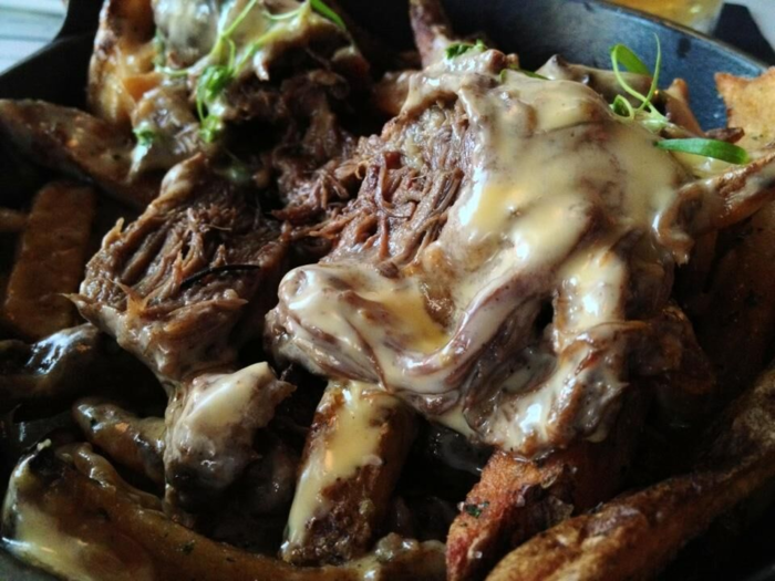 "Duck fat fries" topped with short rib and cheddar can be found at Village Whiskey in Philadelphia.