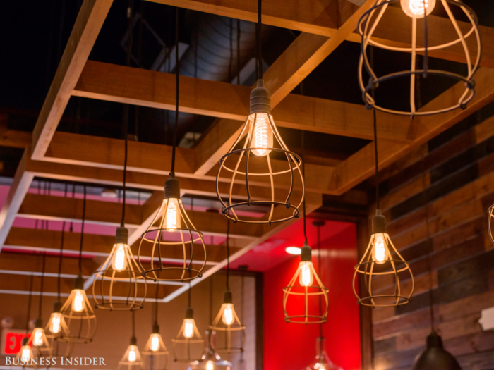 Now, the company has taken care to include little touches of apparent individuality, like these hipster light fixtures, despite the fact that the company is on track to roll out the design at 60 new locations and 160 remodels this year.