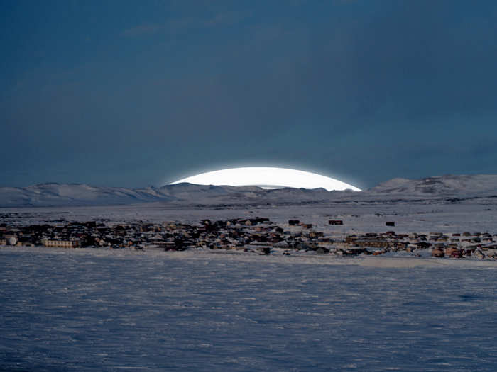 Because the rings neither rise nor set, like the sun or moon, people in Nome, Alaska, would be treated to this constant view of the rings peaking above the horizon.