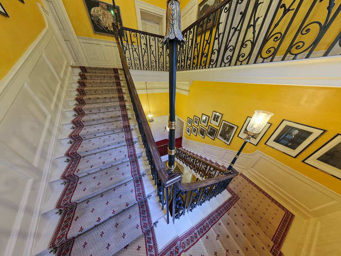 The entrance hall leads to the main staircase, one of the most impressive features of the building.