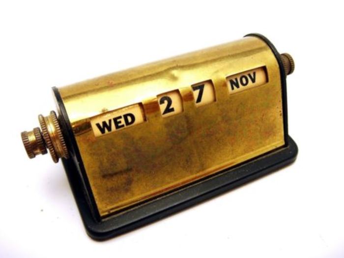 Keep things professional with a brass desk calendar.