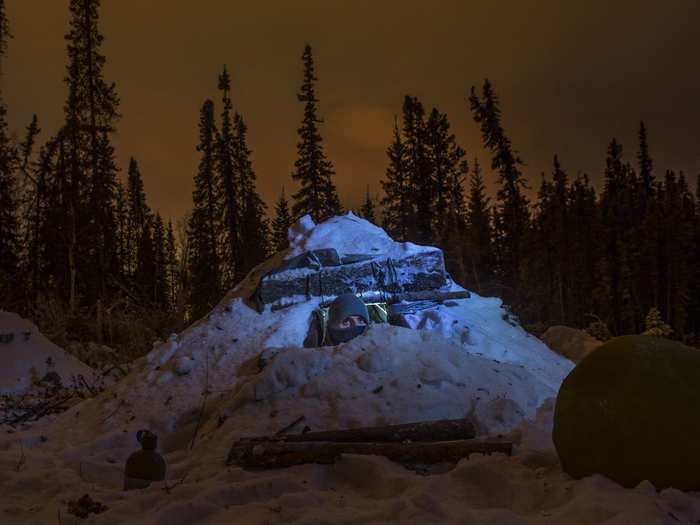 The A-frame is then covered with almost a foot of snow to provide insulation.