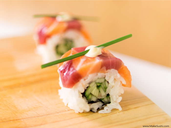 Devaux used the layer of salmon and tuna sashimi that he had created in a different video to top this roll of rice and cucumber. He calls it the royal roll.