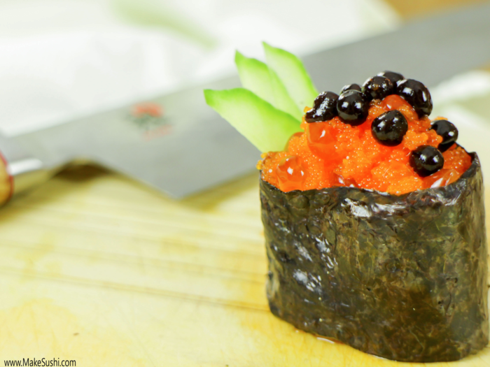 The most interesting part of this battleship sushi roll are its soy sauce pearls, which are made from combining a hot mixture of soy sauce and agar (a jelly-like substance) with chilled olive oil, creating a solid gel-like ball.