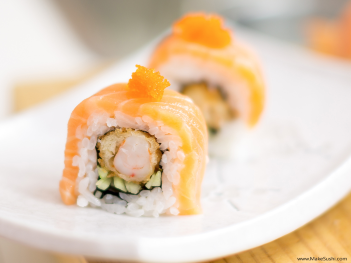 The salmon dreams sushi roll is wrapped in salmon, but features tempura shrimp and cucumber on the inside.