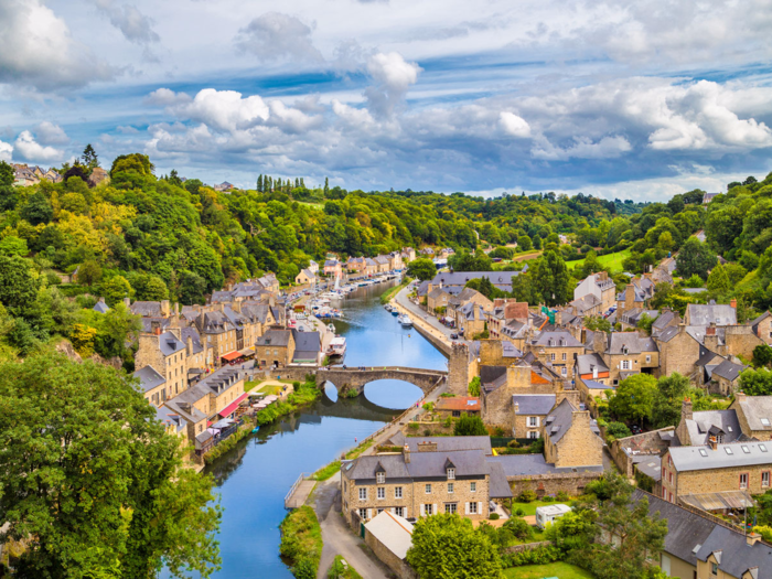 Dinan is a picturesque walled town in Brittany, France, that overlooks the Rance River. Grab a crepe and admire the town