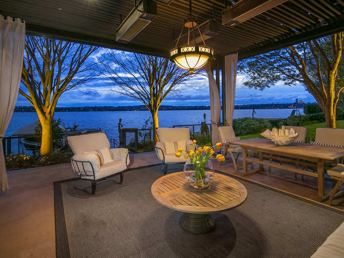 The outdoor living room features all the amenities to enjoy the outdoors 12 months a year. Heat lamps, electric privacy screens, TVs, a BBQ and a Jacuzzi make it the place to be.